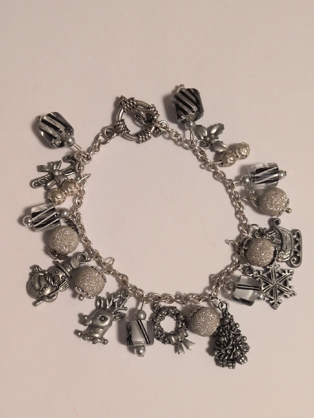 Silver Holiday Charm Bracelet with Black and Silver Accents‎